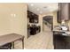 Kitchen with dark brown cabinets, stainless steel appliances, and tiled floors at 1940 N 78Th Gln, Phoenix, AZ 85035