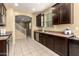 Modern kitchen with dark brown cabinets and stainless steel appliances at 1940 N 78Th Gln, Phoenix, AZ 85035