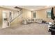 Open living room with grey sofas and a view into the kitchen at 1940 N 78Th Gln, Phoenix, AZ 85035