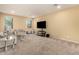 Cozy living room featuring grey couches and a large TV at 1940 N 78Th Gln, Phoenix, AZ 85035