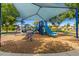 Community playground with shaded play area at 1940 N 78Th Gln, Phoenix, AZ 85035