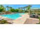 Sparkling community pool with a water feature and shaded seating at 1940 N 78Th Gln, Phoenix, AZ 85035