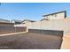 Small backyard with block wall and gravel at 20838 W Granada Rd, Buckeye, AZ 85396