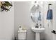 Small bathroom with pedestal sink and toilet at 20838 W Granada Rd, Buckeye, AZ 85396