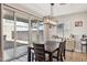 Dining area with sliding glass door and modern light fixture at 20838 W Granada Rd, Buckeye, AZ 85396