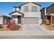 Two-story house with gray exterior, landscaping, and attached garage at 20838 W Granada Rd, Buckeye, AZ 85396