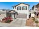 Two-story house with gray exterior, landscaping, and attached garage at 20838 W Granada Rd, Buckeye, AZ 85396