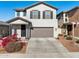 Two-story house with gray exterior, landscaping, and attached garage at 20838 W Granada Rd, Buckeye, AZ 85396