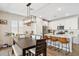 Modern kitchen with island, stainless steel appliances, and white cabinetry at 20838 W Granada Rd, Buckeye, AZ 85396