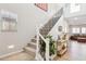 Modern staircase with black spindles and carpet runner at 20838 W Granada Rd, Buckeye, AZ 85396