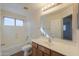 Clean bathroom with vanity, bathtub, and shower at 21404 N Van Loo Dr, Maricopa, AZ 85138