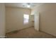 Small bedroom with carpet, ceiling fan, and closet at 21404 N Van Loo Dr, Maricopa, AZ 85138