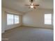 Large bedroom with high ceilings and ceiling fan at 21404 N Van Loo Dr, Maricopa, AZ 85138