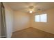 Bright bedroom featuring carpeted floor and window at 21404 N Van Loo Dr, Maricopa, AZ 85138