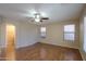 Simple bedroom with wood floors and ceiling fan at 21404 N Van Loo Dr, Maricopa, AZ 85138