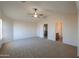 Spacious main bedroom with high ceilings and fan at 21404 N Van Loo Dr, Maricopa, AZ 85138