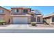 Two-story house with solar panels and desert landscaping at 21404 N Van Loo Dr, Maricopa, AZ 85138