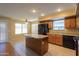 Eat-in kitchen with island and stainless steel appliances at 21404 N Van Loo Dr, Maricopa, AZ 85138