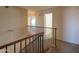 Upstairs hallway with access to bedrooms and stairs at 21404 N Van Loo Dr, Maricopa, AZ 85138