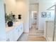 Bright bathroom with a double vanity, linen closet, and a view to a shower at 2191 N Iowa St, Chandler, AZ 85225