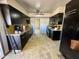 Kitchen with dark cabinetry and granite countertops at 2239 E Wier Ave, Phoenix, AZ 85040