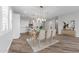 Modern dining area with light wood table and chairs near the kitchen at 22852 E Thornton Rd, Queen Creek, AZ 85142