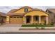 Beautiful craftsman style home with a two-car garage and landscaped yard at 22852 E Thornton Rd, Queen Creek, AZ 85142