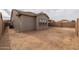 View of backyard with sand ground and block wall at 22878 E Carriage Way, Queen Creek, AZ 85142