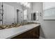 Double vanity bathroom with dark brown cabinets at 22878 E Carriage Way, Queen Creek, AZ 85142