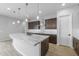 Modern kitchen with granite countertops and dark wood cabinets at 22878 E Carriage Way, Queen Creek, AZ 85142