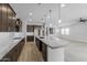 Spacious kitchen featuring granite countertops and dark wood cabinetry at 22878 E Carriage Way, Queen Creek, AZ 85142