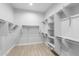 Large walk-in closet with ample shelving and hanging space at 22878 E Carriage Way, Queen Creek, AZ 85142