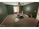 Green-walled bedroom with carpeted floor and ceiling fan at 24013 N Mojave Ln, Florence, AZ 85132