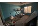 Teal-walled bedroom with bunk bed and carpeted floor at 24013 N Mojave Ln, Florence, AZ 85132