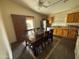 Eat-in kitchen with stainless steel appliances and wood cabinets at 24013 N Mojave Ln, Florence, AZ 85132