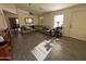 Spacious living room featuring a large sectional sofa and wood-look flooring at 24013 N Mojave Ln, Florence, AZ 85132