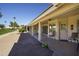 Extended covered patio, ideal for relaxing and entertaining, overlooks a landscaped yard at 2544 S Daisy --, Mesa, AZ 85209