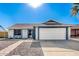 House exterior with a two-car garage at 3235 W Irma Ln, Phoenix, AZ 85027