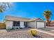 House exterior with a two-car garage at 3235 W Irma Ln, Phoenix, AZ 85027