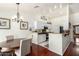 Kitchen with white cabinets and breakfast bar at 3235 W Irma Ln, Phoenix, AZ 85027