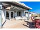 Relaxing covered patio with seating area and artificial turf at 3235 W Irma Ln, Phoenix, AZ 85027