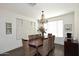 Charming dining room with a wood table and wicker chairs at 3267 E Maplewood St, Gilbert, AZ 85297