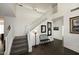 Bright entryway with staircase, bench, and dark hardwood floors at 3267 E Maplewood St, Gilbert, AZ 85297