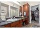 Bathroom boasts a sizable vanity, walk-in closet, and shower at 3302 N 7Th St # 208, Phoenix, AZ 85014