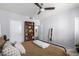 Well-lit bedroom with a queen bed and built-in shelving at 3302 N 7Th St # 208, Phoenix, AZ 85014