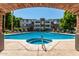 Resort-style pool and spa, viewed through arch at 3302 N 7Th St # 208, Phoenix, AZ 85014