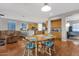 Bright dining area with wood table and chairs, adjacent to kitchen at 3436 E Vaughn Ave, Gilbert, AZ 85234