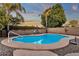 Inviting kidney-shaped pool with surrounding patio and seating at 3436 E Vaughn Ave, Gilbert, AZ 85234