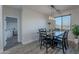 Dining area with table and chairs, adjacent to kitchen and hallway at 3515 N Tewa Cir, Eloy, AZ 85131