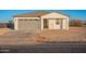 New single-story home with gray garage door and neutral exterior at 3515 N Tewa Cir, Eloy, AZ 85131